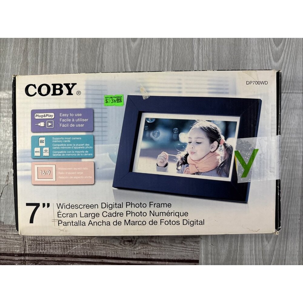 COBY 7" WIDESCREEN DIGITAL PHOTO FRAME MODEL DP700WD. Wood Finish.  2010